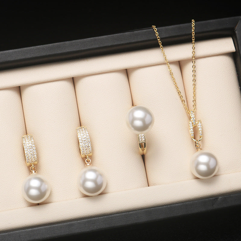 Shell pearl set jewelry three-piece female fashion temperament is round bright light beaded necklace pendant ring earrings